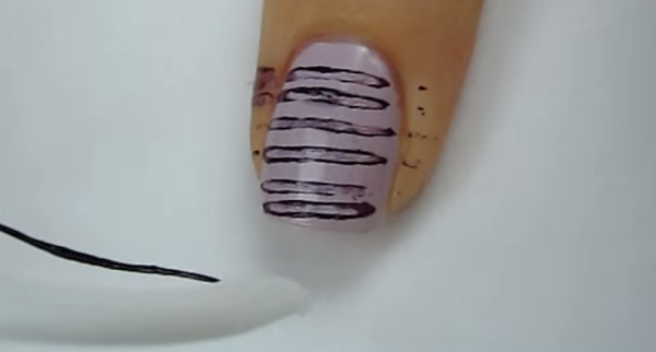 She Presses Dental Floss Across Her Nail. When Shes Done. It Look Incredibly Cool