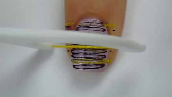 She Presses Dental Floss Across Her Nail. When Shes Done. It Look Incredibly Cool