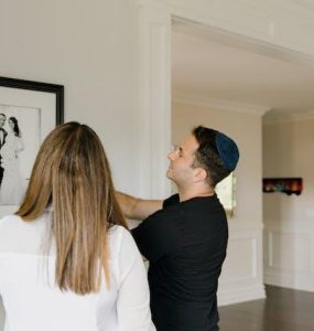 Couple putting up marriage photo